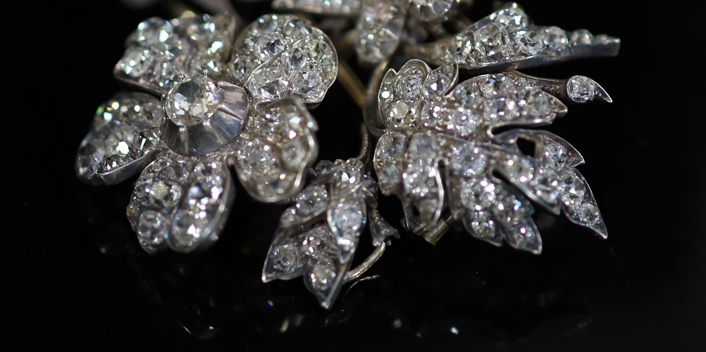 A Victorian gold, silver and diamond encrusted floral spray brooch